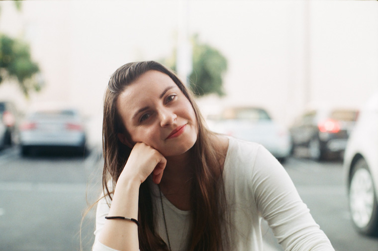 alex in shallow focus in the parking lot