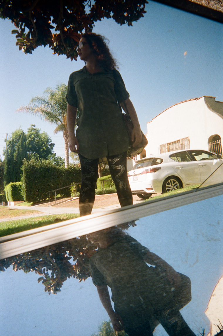 marina reflected in two discarded mirrors