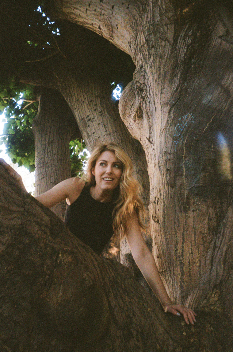 sarah climbing over big trees