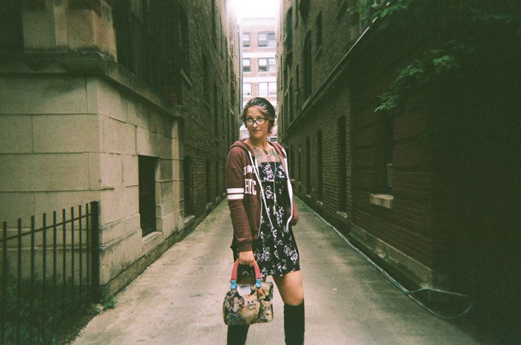 a woman in a brick alley