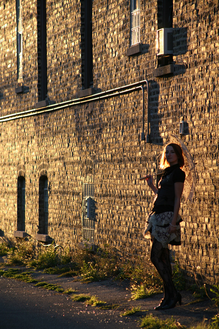 sunset against brick with lauren in steampunk